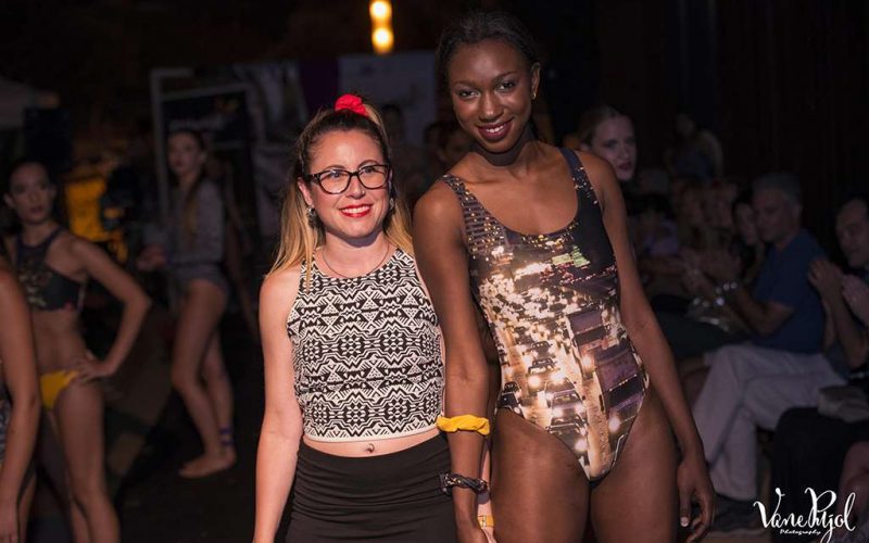 founder Amelia with a model on the catwalk